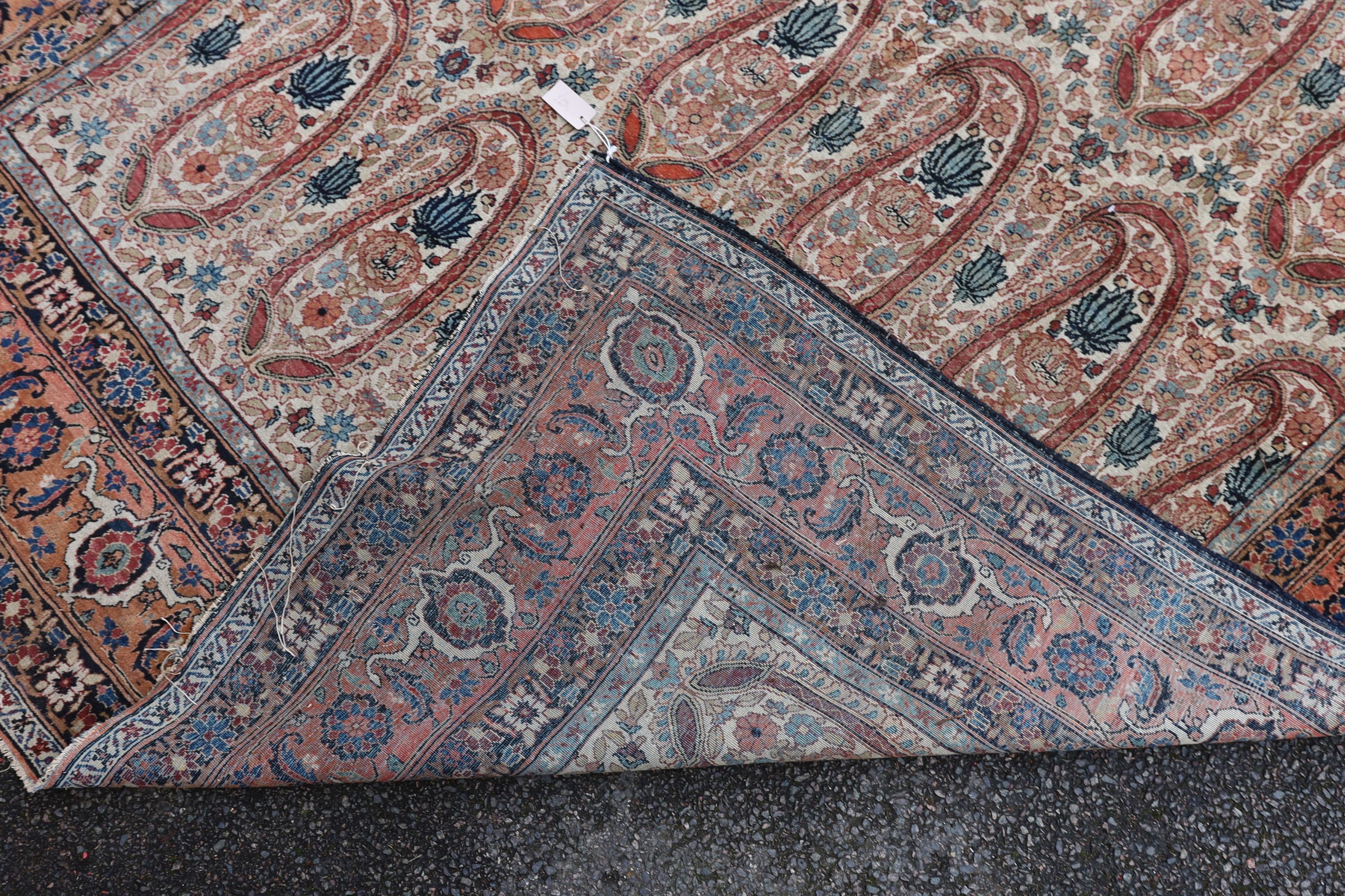 A Kerman rug ivory ground carpet, 360 x 218cm.
